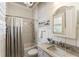 Charming bathroom with a tub/shower and vanity with stone countertop at 157 Lake Forrest Ne Ln, Atlanta, GA 30342