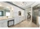 Bright bathroom featuring double vanity sinks and an oversized glass shower at 157 Lake Forrest Ne Ln, Atlanta, GA 30342