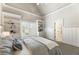 Bright bedroom with built-in shelving and ensuite bathroom at 157 Lake Forrest Ne Ln, Atlanta, GA 30342