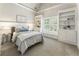 Bright bedroom featuring built-in shelving and a cozy window seat, creating a relaxing atmosphere at 157 Lake Forrest Ne Ln, Atlanta, GA 30342