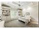Bright bedroom featuring built in shelves and storage at 157 Lake Forrest Ne Ln, Atlanta, GA 30342
