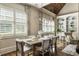 Bright dining area featuring a wood ceiling, built-in shelving, and plantation shutters at 157 Lake Forrest Ne Ln, Atlanta, GA 30342