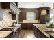 Elegant kitchen with professional-grade appliances, a granite-topped island, and ample storage at 157 Lake Forrest Ne Ln, Atlanta, GA 30342