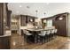 Spacious kitchen island with granite countertops, custom cabinets, and pendant lighting at 157 Lake Forrest Ne Ln, Atlanta, GA 30342