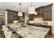Kitchen boasts a large island with granite countertops, seating and stainless steel appliances at 157 Lake Forrest Ne Ln, Atlanta, GA 30342