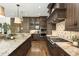 Gourmet kitchen features granite counters, custom cabinetry, and stainless steel appliances at 157 Lake Forrest Ne Ln, Atlanta, GA 30342