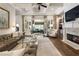 Living room boasts a fireplace, coffered ceiling, French doors, and comfortable seating at 157 Lake Forrest Ne Ln, Atlanta, GA 30342