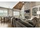 Inviting living room featuring a stone fireplace, wood ceiling, and custom built-ins for a cozy ambiance at 157 Lake Forrest Ne Ln, Atlanta, GA 30342