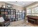 This cozy living room boasts vintage record collection, a piano, and natural light at 157 Lake Forrest Ne Ln, Atlanta, GA 30342