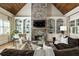 Inviting living room showcases stone fireplace, built-in shelving, and hardwood floors at 157 Lake Forrest Ne Ln, Atlanta, GA 30342