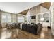 Open-concept living room with stone fireplace, custom built-ins, and lots of natural light at 157 Lake Forrest Ne Ln, Atlanta, GA 30342