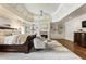 Spacious primary bedroom with hardwood floors, fireplace, and coffered ceiling at 157 Lake Forrest Ne Ln, Atlanta, GA 30342