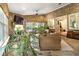 Relaxing sunroom with natural light, exposed brick, and views of the outdoors at 157 Lake Forrest Ne Ln, Atlanta, GA 30342