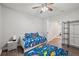 bedroom with colorful dinosaur-themed decorations, rug, and pillows at 2995 Barimore, Dacula, GA 30019
