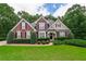 Charming brick home with manicured landscaping and a welcoming front entrance at 2995 Barimore, Dacula, GA 30019