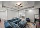 Open-concept living room with modern furniture, a ceiling fan, and hardwood floors at 2995 Barimore, Dacula, GA 30019