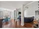 Open-concept living room with hardwood floors, fireplace, and bright, natural light at 2995 Barimore, Dacula, GA 30019