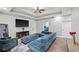 Spacious living room featuring hardwood floors, a tv, and a sectional sofa at 2995 Barimore, Dacula, GA 30019