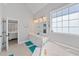 Bright main bathroom with double vanity, soaking tub, and a large window at 2995 Barimore, Dacula, GA 30019