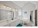 Main bathroom featuring double vanity sinks, a soaking tub, and a separate shower at 2995 Barimore, Dacula, GA 30019