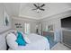 Main bedroom featuring a tray ceiling, ceiling fan, and a plush king-size bed at 2995 Barimore, Dacula, GA 30019