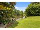 Scenic backyard view featuring lush greenery and a serene pond at 347 Oakhurst Dr, Marietta, GA 30066