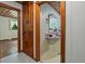 Hallway view of bathroom with vanity, floral wallpaper, and built-in storage at 347 Oakhurst Dr, Marietta, GA 30066