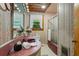 Compact bathroom featuring patterned wallpaper and a walk-in shower at 347 Oakhurst Dr, Marietta, GA 30066