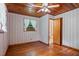Bedroom leading to bathroom with hardwood floors and patterned wallpaper at 347 Oakhurst Dr, Marietta, GA 30066
