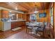 Cozy dining area with wood accents, a rustic table set for dinner, and natural light at 347 Oakhurst Dr, Marietta, GA 30066
