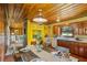 Open-concept dining room flowing into kitchen with bright yellow accents at 347 Oakhurst Dr, Marietta, GA 30066