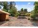 Long driveway leading to a carport, surrounded by lush greenery at 347 Oakhurst Dr, Marietta, GA 30066