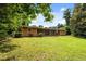 Charming single-story home with a screen porch and a beautiful green lawn at 347 Oakhurst Dr, Marietta, GA 30066