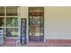 Welcoming front porch with a welcome sign and view into the home's screened porch and surrounding nature at 347 Oakhurst Dr, Marietta, GA 30066