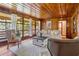 Inviting living room featuring wood paneling, hardwood floors and a light-filled seating area at 347 Oakhurst Dr, Marietta, GA 30066