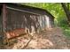 Exterior view of a shed, surrounded by lush greenery and natural foliage at 347 Oakhurst Dr, Marietta, GA 30066
