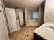 Bathroom with a corner tub, and tile flooring, with the commode in its own enclosure at 1120 Northern Run, Stockbridge, GA 30281
