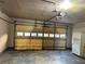 Spacious garage with an automatic door and a refrigerator at 1120 Northern Run, Stockbridge, GA 30281