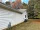 Exterior of a home with vinyl siding, an external meter, and a well-manicured lawn at 1120 Northern Run, Stockbridge, GA 30281
