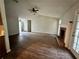 Open-concept living room with a fireplace, vaulted ceiling, and laminate flooring at 1120 Northern Run, Stockbridge, GA 30281
