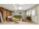 Partially finished basement with sofas, chairs, and a window at 11270 Stroup Road, Roswell, GA 30075