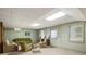 Finished basement area features sofas, chairs, and natural light from the windows at 11270 Stroup Road, Roswell, GA 30075