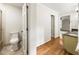 Bathroom with a toilet and the view of the sink at 11270 Stroup Road, Roswell, GA 30075