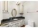 Elegant bathroom featuring a vanity with white and gold trim at 11270 Stroup Road, Roswell, GA 30075