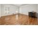 Bedroom featuring hardwood floors, with windows and a wooden desk with a chair at 11270 Stroup Road, Roswell, GA 30075