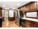 Spacious kitchen with stainless steel appliances, wood cabinets, and modern finishes at 11270 Stroup Road, Roswell, GA 30075