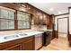 Well-maintained kitchen with wood cabinets, granite counters, and stainless steel appliances at 11270 Stroup Road, Roswell, GA 30075