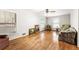 This living room has wood floors, neutral paint, and lots of natural light from the windows at 11270 Stroup Road, Roswell, GA 30075