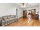 The living room has wood floors and neutral paint and lots of living space at 11270 Stroup Road, Roswell, GA 30075