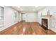 Spacious living room featuring hardwood floors, a fireplace, and recessed lighting at 11270 Stroup Road, Roswell, GA 30075